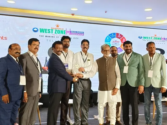 Elite Associates receiving a trophy at the NAREDCO West Zone Builders Association Telangana event